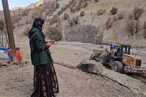 Bakhtiari nomads of Iran,The arrival of the loader and smoothing the path to the house